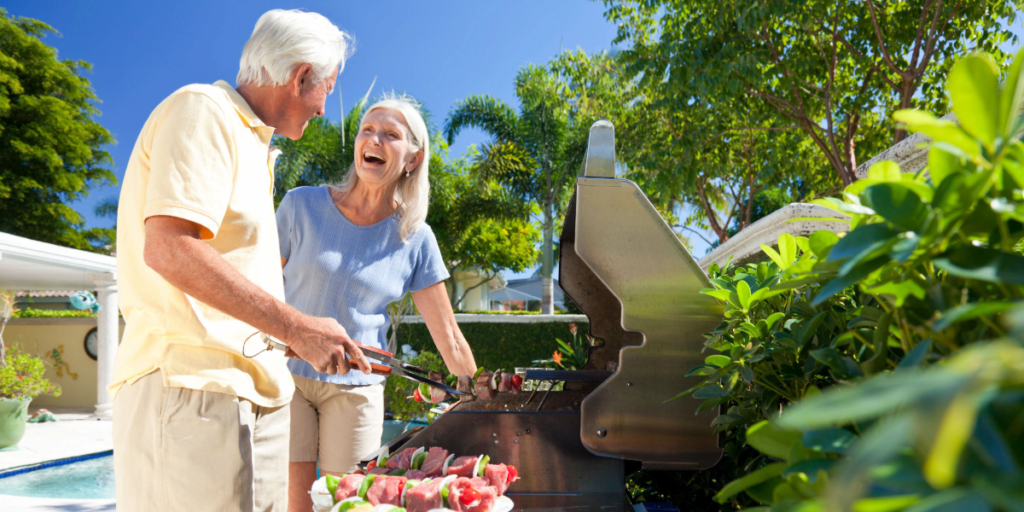 Elderly couple grilling high protein meal together